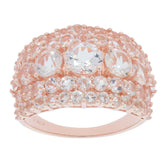 Rose gold ring with sparkling clear gemstones, featuring a round design and intricate details, perfect for elegant occasions.